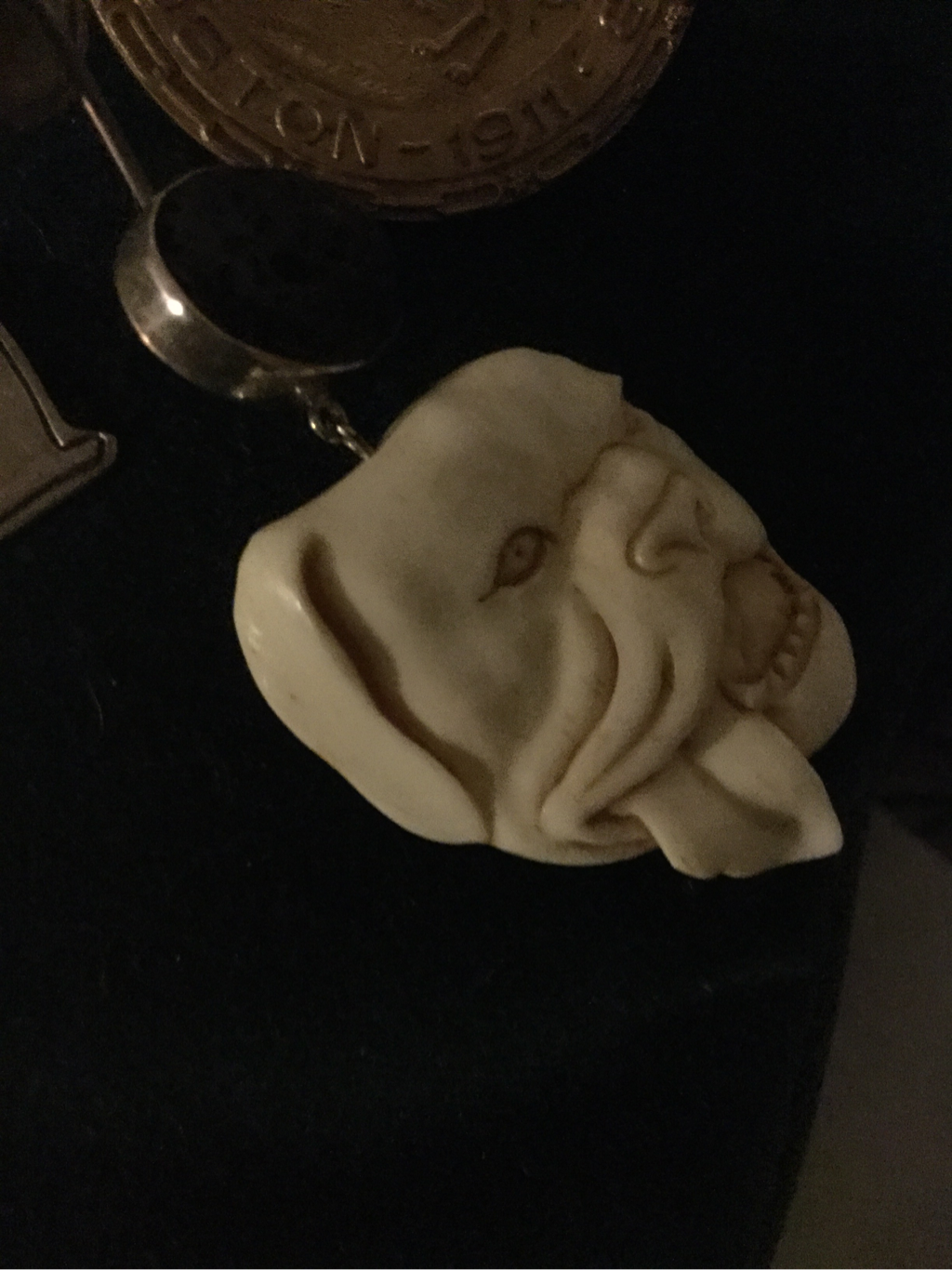 Carved bulldog head