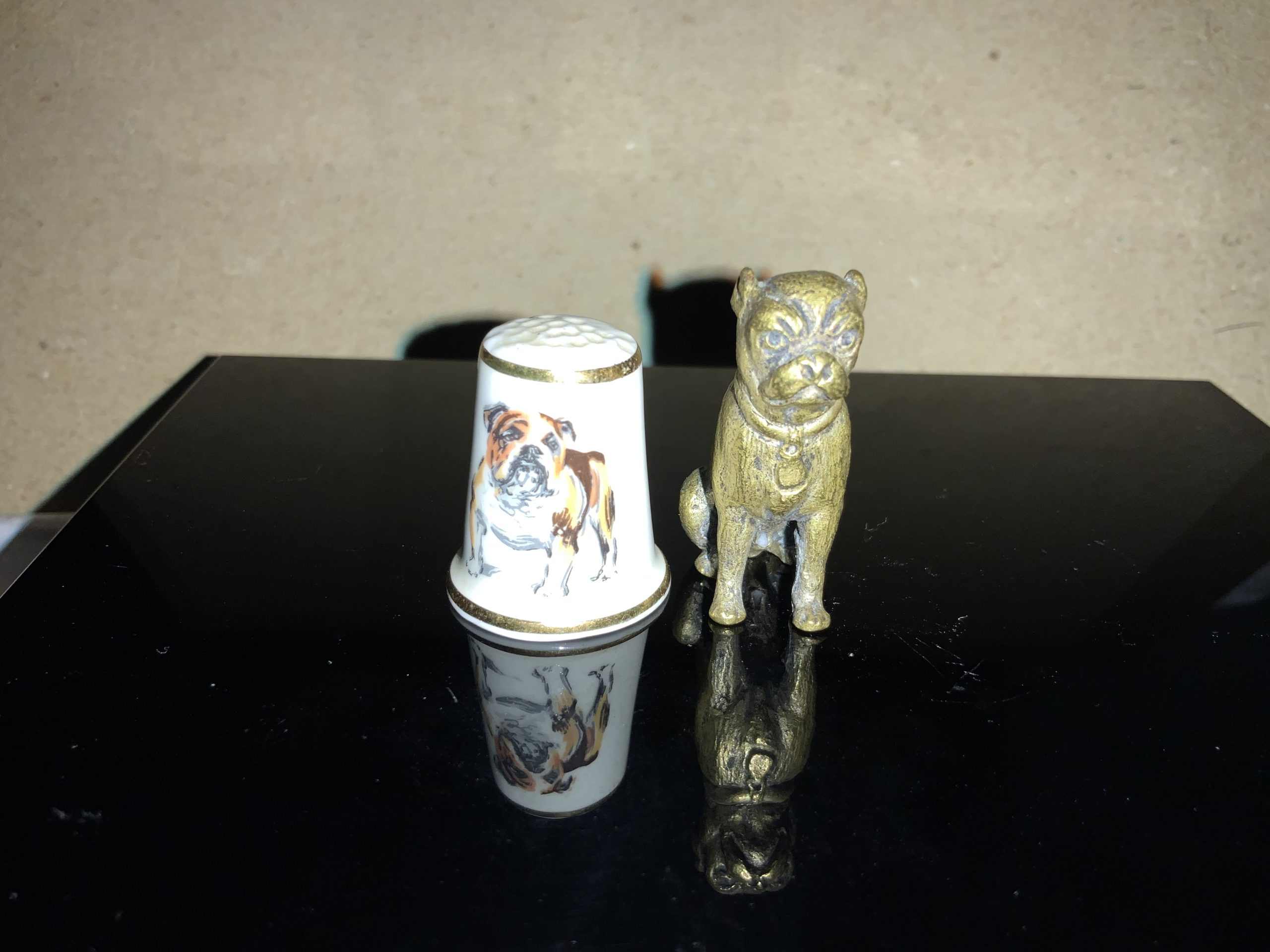 Amazing thimble sized bulldog statuettes 