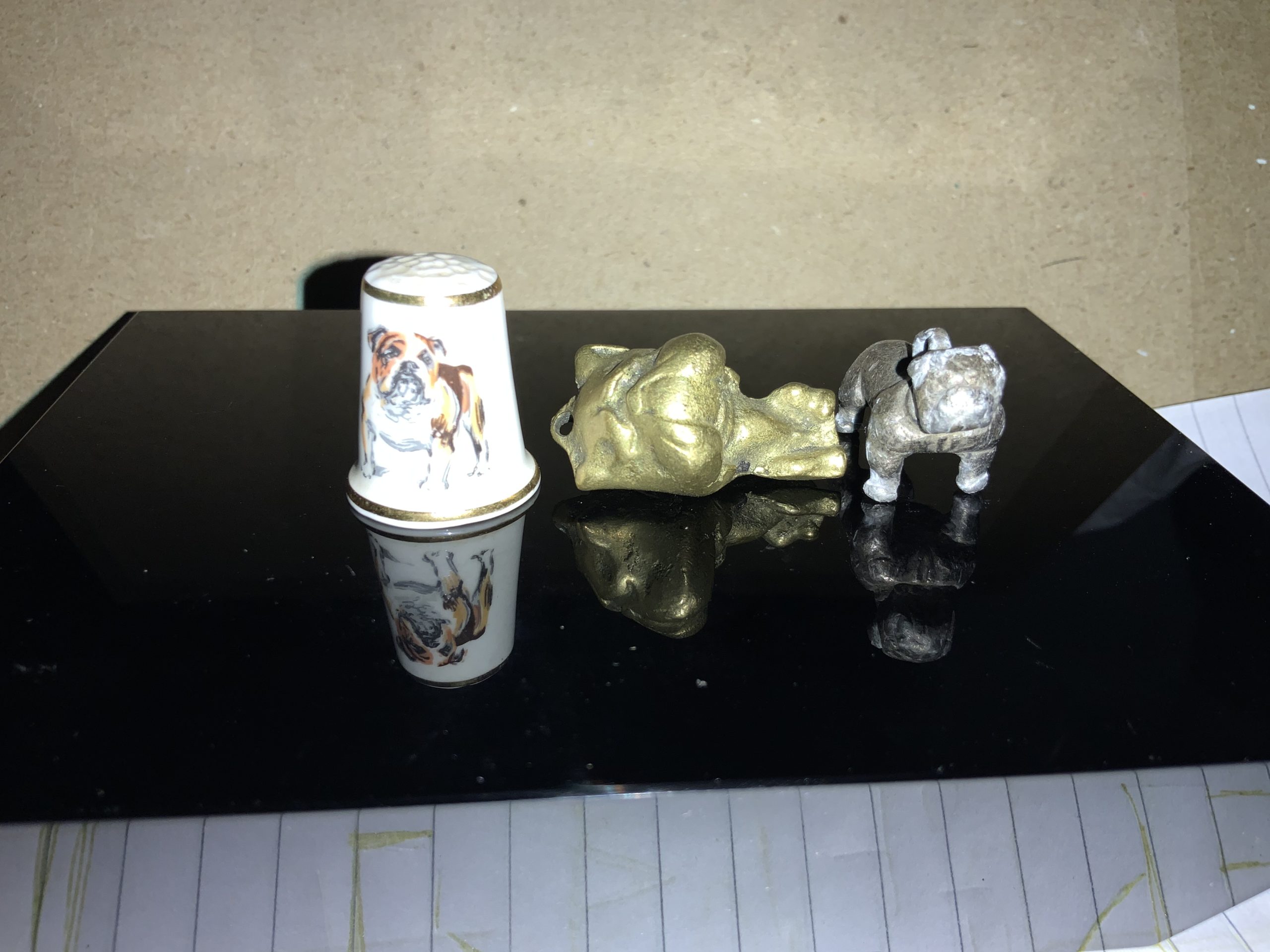 Amazing thimble sized bulldog statuettes