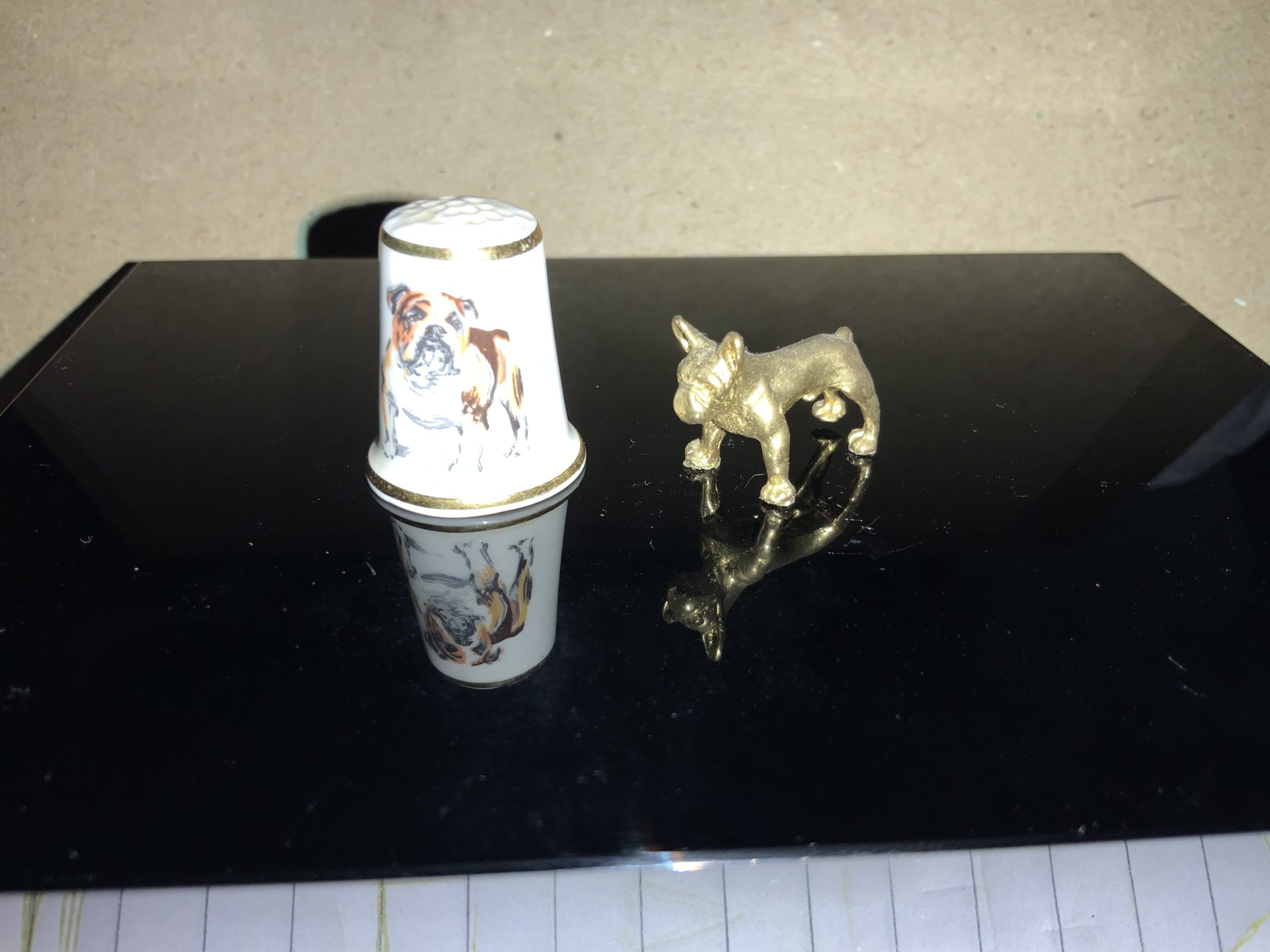 Amazing thimble sized bulldog statuettes