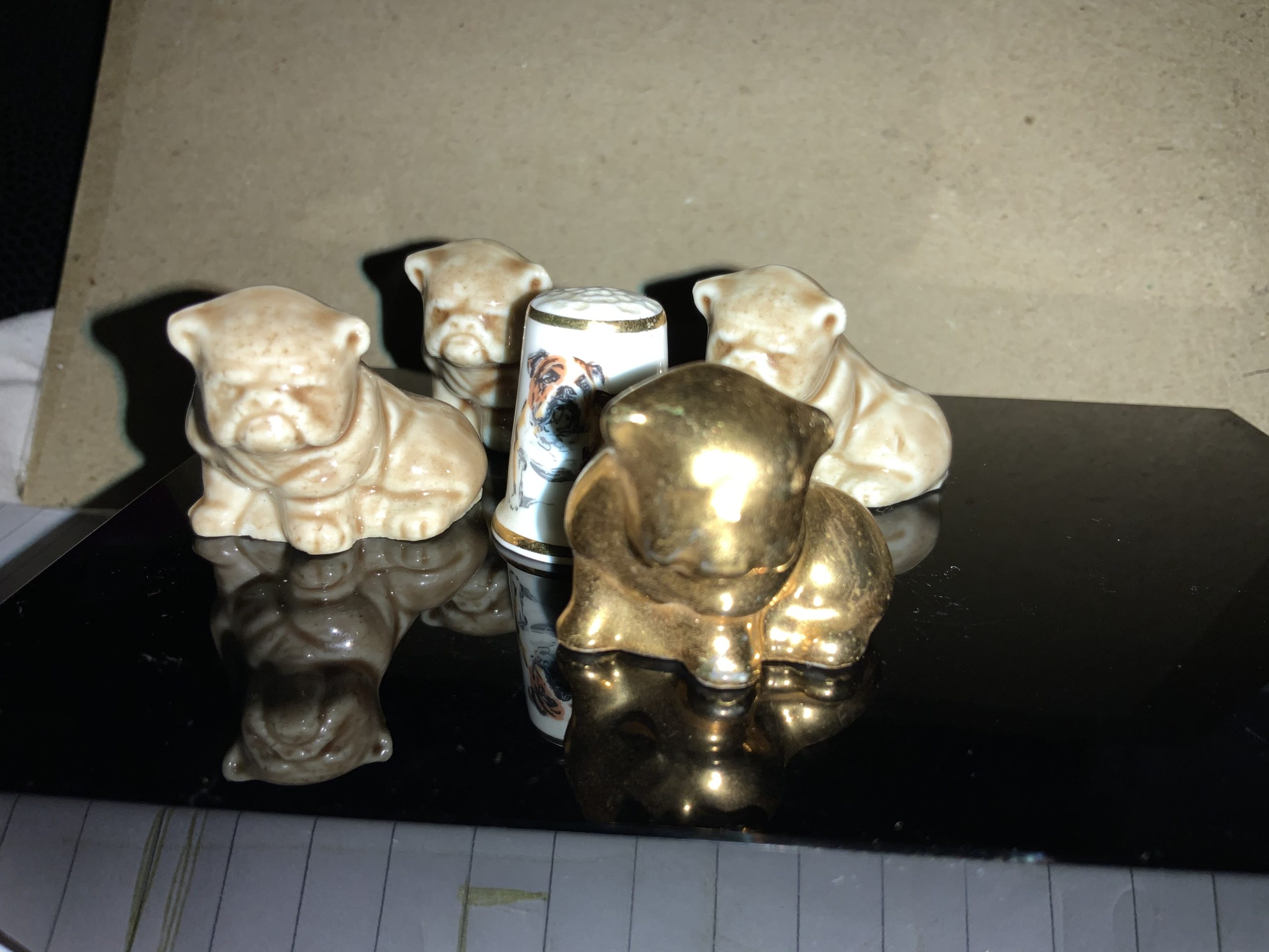 Amazing thimble sized bulldog statuettes 