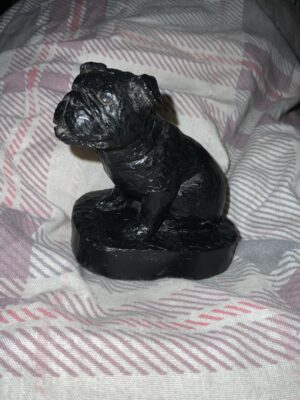 A bulldog figurine made from coal 